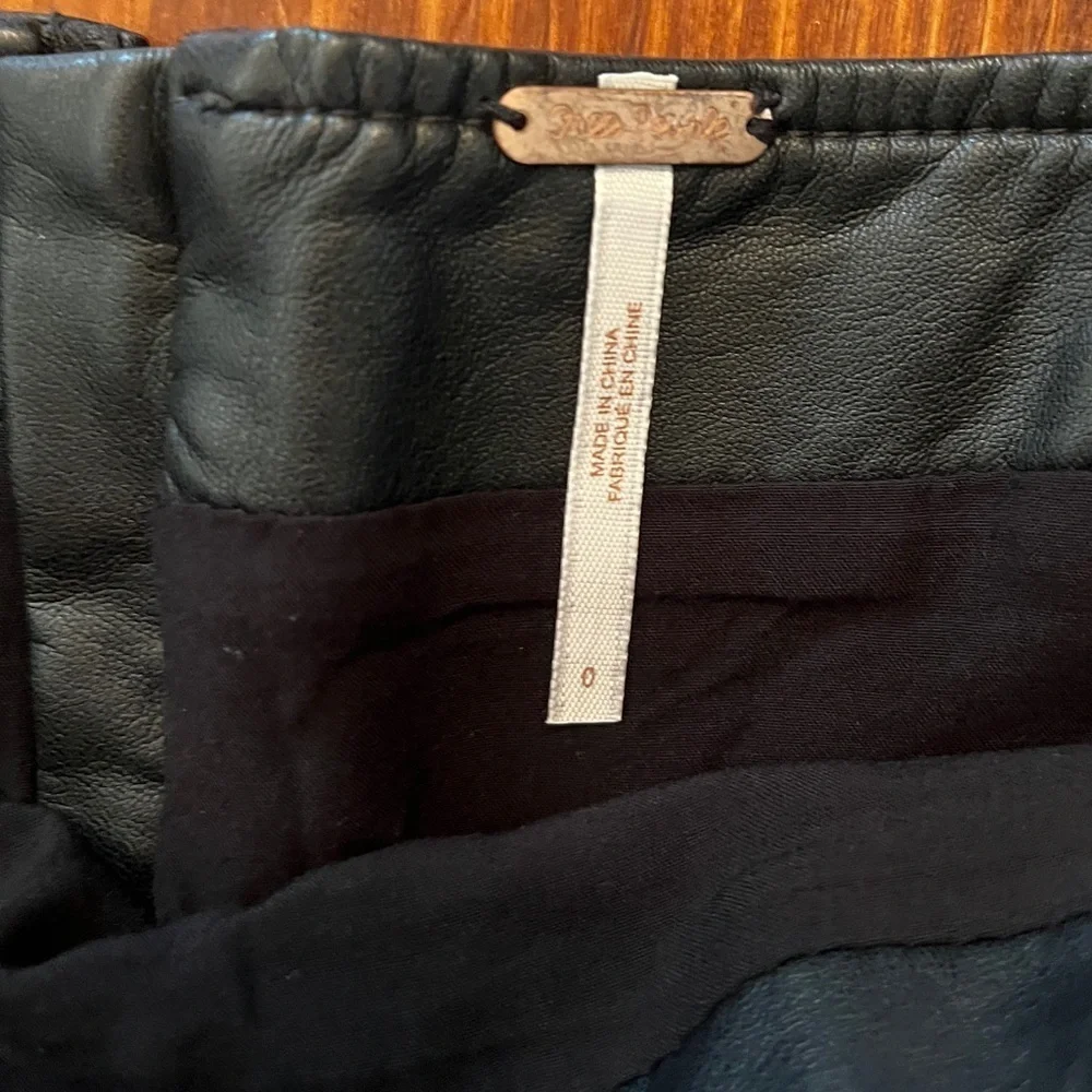 FREE PEOPLE Revolve Charli Black Faux Leather Mini Skirt Buckles Back Zipper